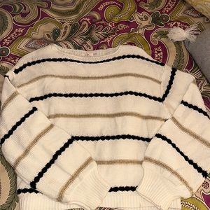 Really beautiful white, black, and gold sweater. Size Small.